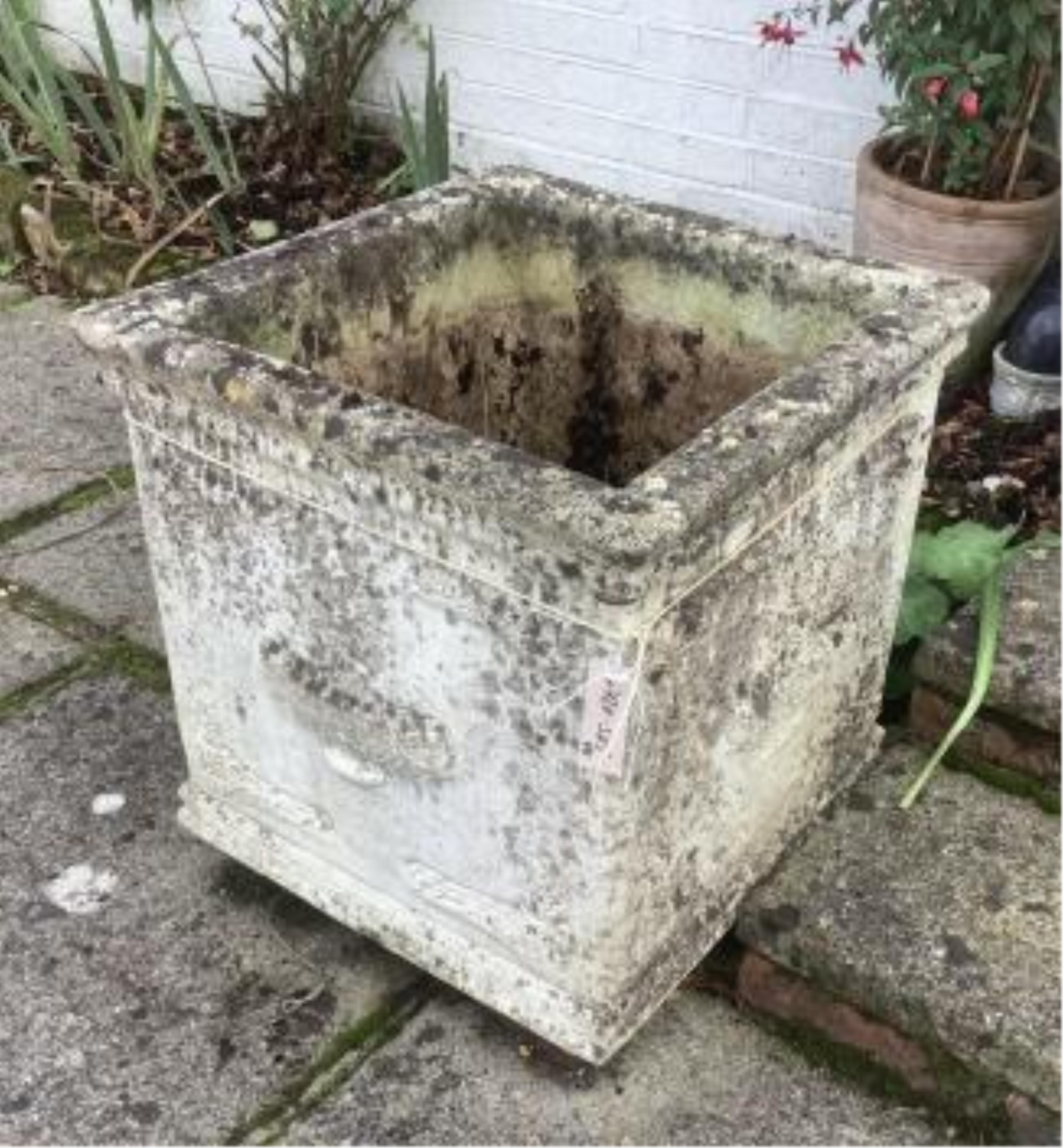 A pair of square reconstituted stone planters, width 50cm, height 49cm, planting removed. Condition - weathered, otherwise good